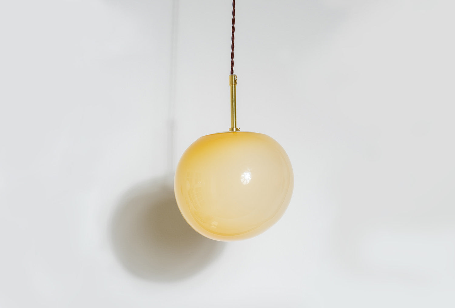 pendant made of glass in yellow with brass fitting